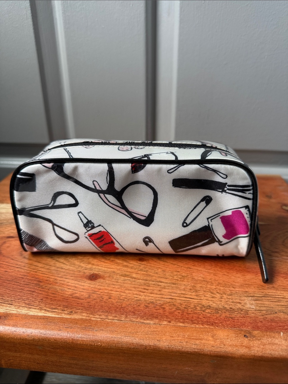 kate spade White Cosmetic Bag with Black Line Art and Pink & Red Accents